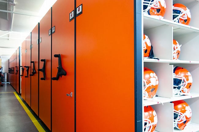 Mechanical Assist Mobile Shelving Storing Football Helmets and Gear