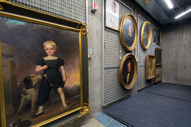 Framed Art Work Hung on Wall-Mounted Screens