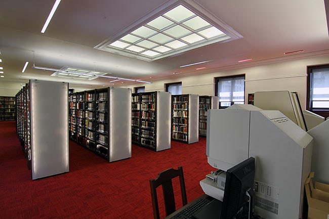 Academic Library Shelving with Lighted Glass End Panels