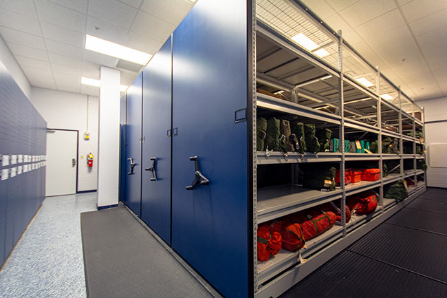 Mechanical-Assist Compact Shelving Storing Military Flight Crew Gear