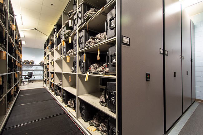 Military Gear Cases Stored on Powered Mobile Shelving