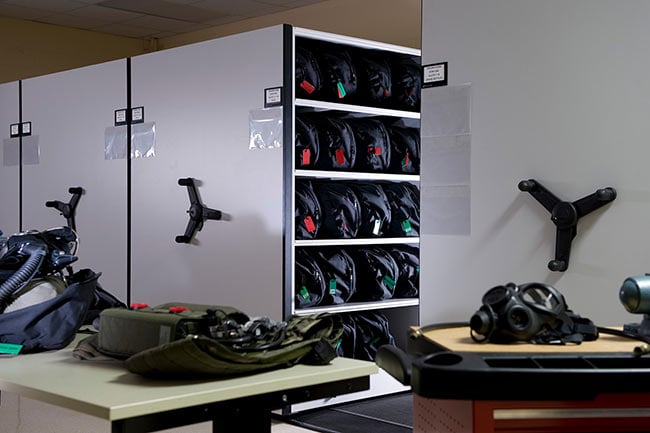 Military Gear Stored on Mechanical-Assist Mobile Shelving
